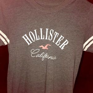 Hollister shirt. This 1 has White stripes on sleeves it looks amazing and pretty
